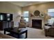 Comfortable living room featuring a fireplace, stylish furniture, and natural light at 5932 Edelle Dr, Indianapolis, IN 46237