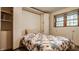 Bedroom featuring a built-in murphy bed with a window allowing natural light at 6295 N Olney St, Indianapolis, IN 46220