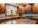 Bright kitchen featuring granite countertops, stainless steel appliances, and natural light at 6295 N Olney St, Indianapolis, IN 46220