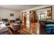 Cozy living room with hardwood floors, comfortable seating, and natural light at 6295 N Olney St, Indianapolis, IN 46220