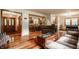 A bright living room leads into an open kitchen and dining area with wood floors at 6295 N Olney St, Indianapolis, IN 46220