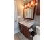 Cozy bathroom featuring a vanity with cabinet, a standard toilet, and neutral wall color at 63 Longfellow Ln, Greenfield, IN 46140