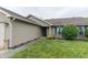 Attractive home exterior featuring a well-kept lawn, lovely flowerbeds, and manicured shrubbery at 63 Longfellow Ln, Greenfield, IN 46140