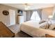 Serene main bedroom featuring a ceiling fan, soft lighting, and a relaxing ambiance at 63 Longfellow Ln, Greenfield, IN 46140