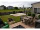 Backyard featuring a patio, basketball court, and ample space for outdoor activities at 6524 Amick Way, Indianapolis, IN 46268