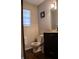Cozy bathroom featuring a modern vanity and toilet at 6524 Amick Way, Indianapolis, IN 46268