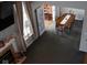 Elevated view of carpeted dining room with fireplace, large window and view into next room at 6524 Amick Way, Indianapolis, IN 46268