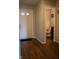 Bright entryway with wood-look floors, leading to a powder room at 6524 Amick Way, Indianapolis, IN 46268