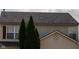 Close-up exterior showcasing roofline, siding, and architectural details of this charming two story home at 6524 Amick Way, Indianapolis, IN 46268