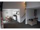 Open living area with dining table, kitchen access, and a cozy couch perfect for relaxing at 6524 Amick Way, Indianapolis, IN 46268
