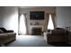Inviting living room with a fireplace, comfortable seating, and modern entertainment setup at 6524 Amick Way, Indianapolis, IN 46268