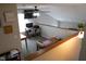 Upstairs loft area featuring desk space, natural light, and a ceiling fan for comfortable living at 6524 Amick Way, Indianapolis, IN 46268
