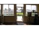 View through the doorway to the backyard, showing a well-maintained lawn and the neighbor's home at 6524 Amick Way, Indianapolis, IN 46268