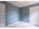 Empty bedroom showcasing a neutral carpet, white trim, and two closets at 6937 Thousand Oaks Dr, Indianapolis, IN 46214