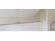 Upstairs hallway with white walls, wood railing, and neutral carpet at 6937 Thousand Oaks Dr, Indianapolis, IN 46214