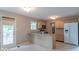Functional kitchen with a breakfast bar, wood cabinets, and a door to the deck at 6937 Thousand Oaks Dr, Indianapolis, IN 46214