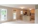 Eat-in kitchen with light wood cabinets and a door leading to the outdoor patio at 6937 Thousand Oaks Dr, Indianapolis, IN 46214