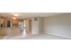 Open concept living space combining a kitchen and a living room with neutral decor at 6937 Thousand Oaks Dr, Indianapolis, IN 46214