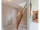 Classic staircase with carpeted steps and a wooden banister leading to the upper floor at 6937 Thousand Oaks Dr, Indianapolis, IN 46214