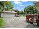 View of the garage and backyard from the spacious deck at 7113 Chandler Dr, Indianapolis, IN 46217
