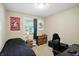 Simple bedroom featuring a twin bed, dark furniture, and themed decor at 7113 Chandler Dr, Indianapolis, IN 46217