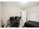 Spacious bedroom featuring a desk and gaming equipment at 7113 Chandler Dr, Indianapolis, IN 46217