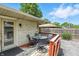 Backyard deck with outdoor seating, leading to the house entrance at 7113 Chandler Dr, Indianapolis, IN 46217