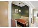 Cozy dining nook featuring booth seating, wood table, and stylish overhead lighting at 7113 Chandler Dr, Indianapolis, IN 46217