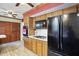 Kitchen featuring matching appliances, wooden cabinetry, and easy access to pantry storage at 7113 Chandler Dr, Indianapolis, IN 46217