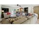 Open-concept living room with a large sectional sofa, comfortable seating, and a seamless flow into dining at 7113 Chandler Dr, Indianapolis, IN 46217