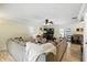 Spacious living room featuring a large sectional sofa, entertainment center, and seamless flow into the dining at 7113 Chandler Dr, Indianapolis, IN 46217