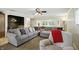 Comfortable living room with a large sectional sofa, plush recliner, and views into other areas at 7113 Chandler Dr, Indianapolis, IN 46217