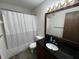 Bathroom featuring a vanity with black countertops, a toilet, and shower with curtain at 7220 Village Pkwy Dr # 3, Indianapolis, IN 46254