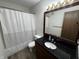 Bathroom featuring a vanity with black countertops, a toilet, and shower with curtain at 7220 Village Pkwy Dr # 3, Indianapolis, IN 46254