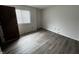 Bright bedroom with a window for natural light and wood-look flooring at 7220 Village Pkwy Dr # 3, Indianapolis, IN 46254