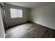 Bright bedroom with a window for natural light and wood-look flooring at 7220 Village Pkwy Dr # 3, Indianapolis, IN 46254