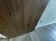 Close up of wooden door with minor damage; light grey LVP flooring can be seen at 7220 Village Pkwy Dr # 3, Indianapolis, IN 46254