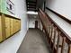 Interior hallway features carpeted floor, mailboxes, and a wooden staircase at 7220 Village Pkwy Dr # 3, Indianapolis, IN 46254