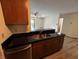 The kitchen sink and countertop look out towards the living room and backyard at 7220 Village Pkwy Dr # 3, Indianapolis, IN 46254