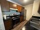 Beautiful kitchen with stainless steel appliances, wooden cabinets, and granite countertops at 7220 Village Pkwy Dr # 3, Indianapolis, IN 46254