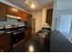 Kitchen with stainless steel appliances, granite counters and overhead vent and lighting at 7220 Village Pkwy Dr # 3, Indianapolis, IN 46254