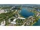 Aerial view of a waterfront community surrounded by lush greenery and lakes at 7601 Newport Bay Dr # 115, Indianapolis, IN 46240