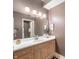 Bathroom features a wooden vanity with ample counter space and great lighting at 7601 Newport Bay Dr # 115, Indianapolis, IN 46240