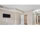 Spacious bedroom featuring a mounted TV and ensuite bathroom at 7601 Newport Bay Dr # 115, Indianapolis, IN 46240