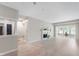 Bright and airy living room features hardwood floors, a cozy fireplace, and large bay windows at 7601 Newport Bay Dr # 115, Indianapolis, IN 46240