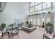 Open lobby with ample seating, tile flooring, and indoor fountain at 7601 Newport Bay Dr # 115, Indianapolis, IN 46240