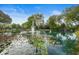 Scenic pond with water features, lily pads and lush green trees at NewPort Bay Condominiums is a tranquil outdoor area at 7601 Newport Bay Dr # 115, Indianapolis, IN 46240