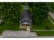 Aerial view of the home showcasing the roof, backyard, and nearby trees at 7727 Huff St, Indianapolis, IN 46259