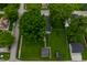 A bird's-eye view of the home with its expansive yard and tree-lined surroundings at 7727 Huff St, Indianapolis, IN 46259