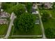 A bird's-eye view of the property, surrounded by vibrant greenery and neighborhood streets at 7727 Huff St, Indianapolis, IN 46259